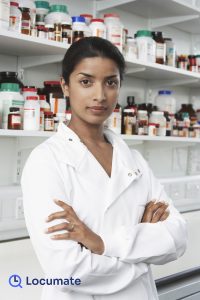 Portrait of confident female pharmacist in pharmacy locum work